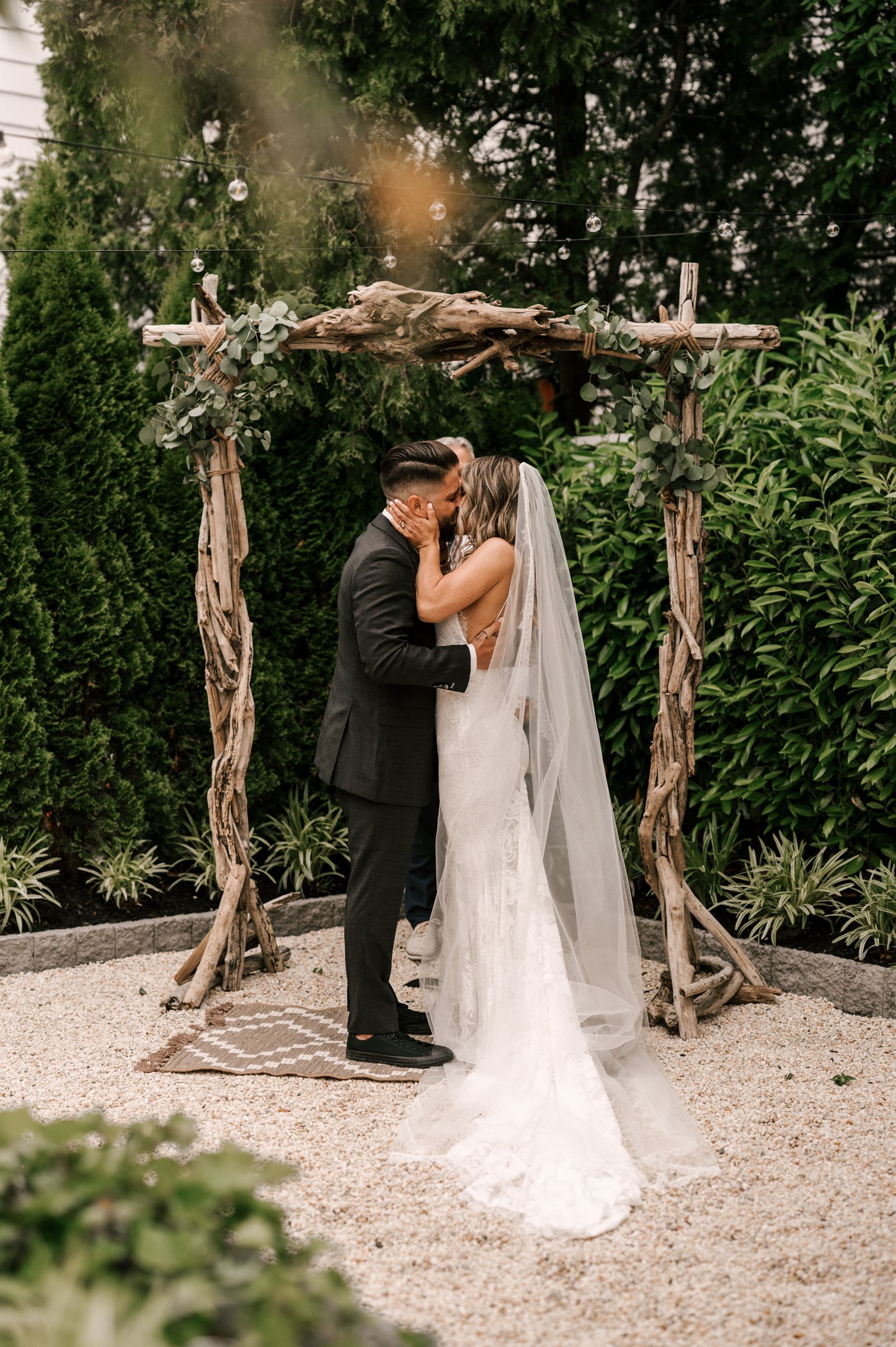 Garden micro wedding ceremony with intimate seating and refined floral styling.